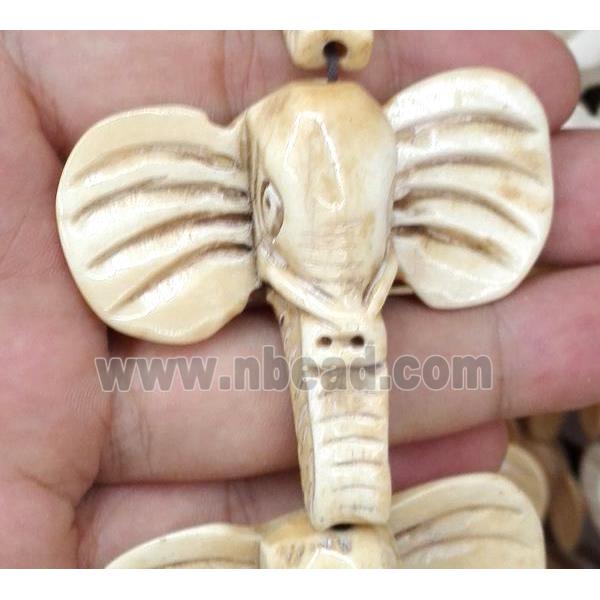 antique cattle bone beads, elephant, yellow