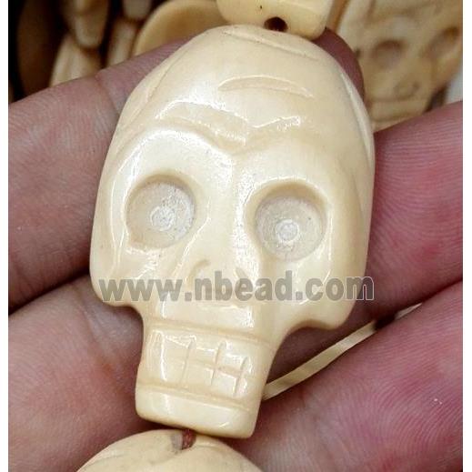 antique cattle bone beads, skull, yellow