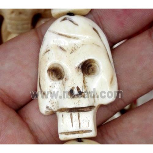 white antique cattle bone beads, skull