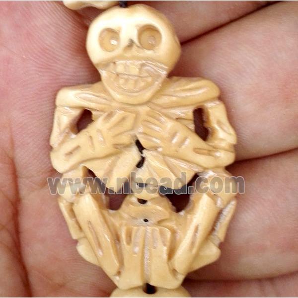 antique cattle bone beads, skull, yellow