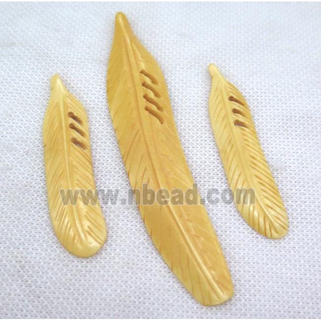 yellow bone feather pendant