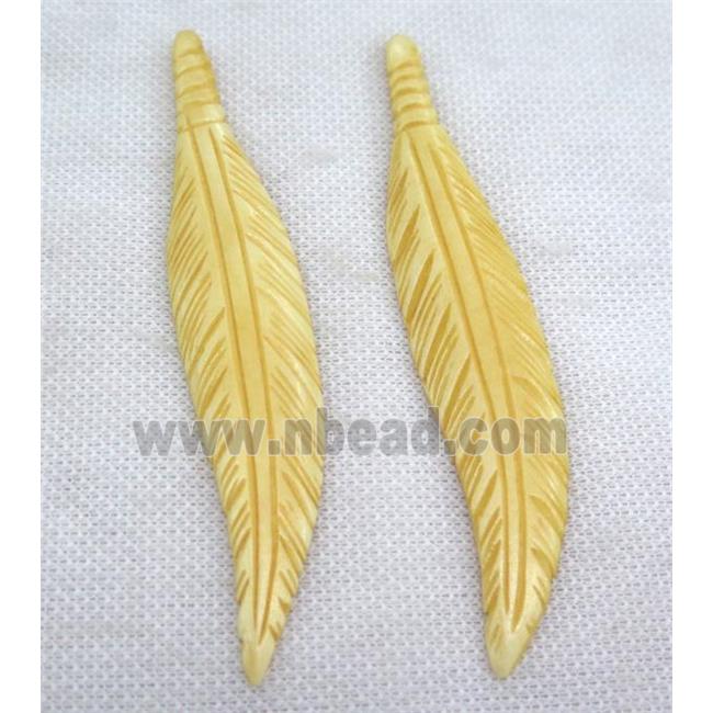 yellow bone feather pendant