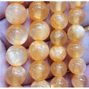 round jade beads, orange dye, approx 6mm dia