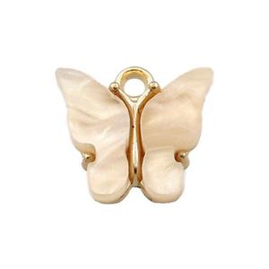 peach pearlized Glass butterfly pendant, gold plated, approx 13mm